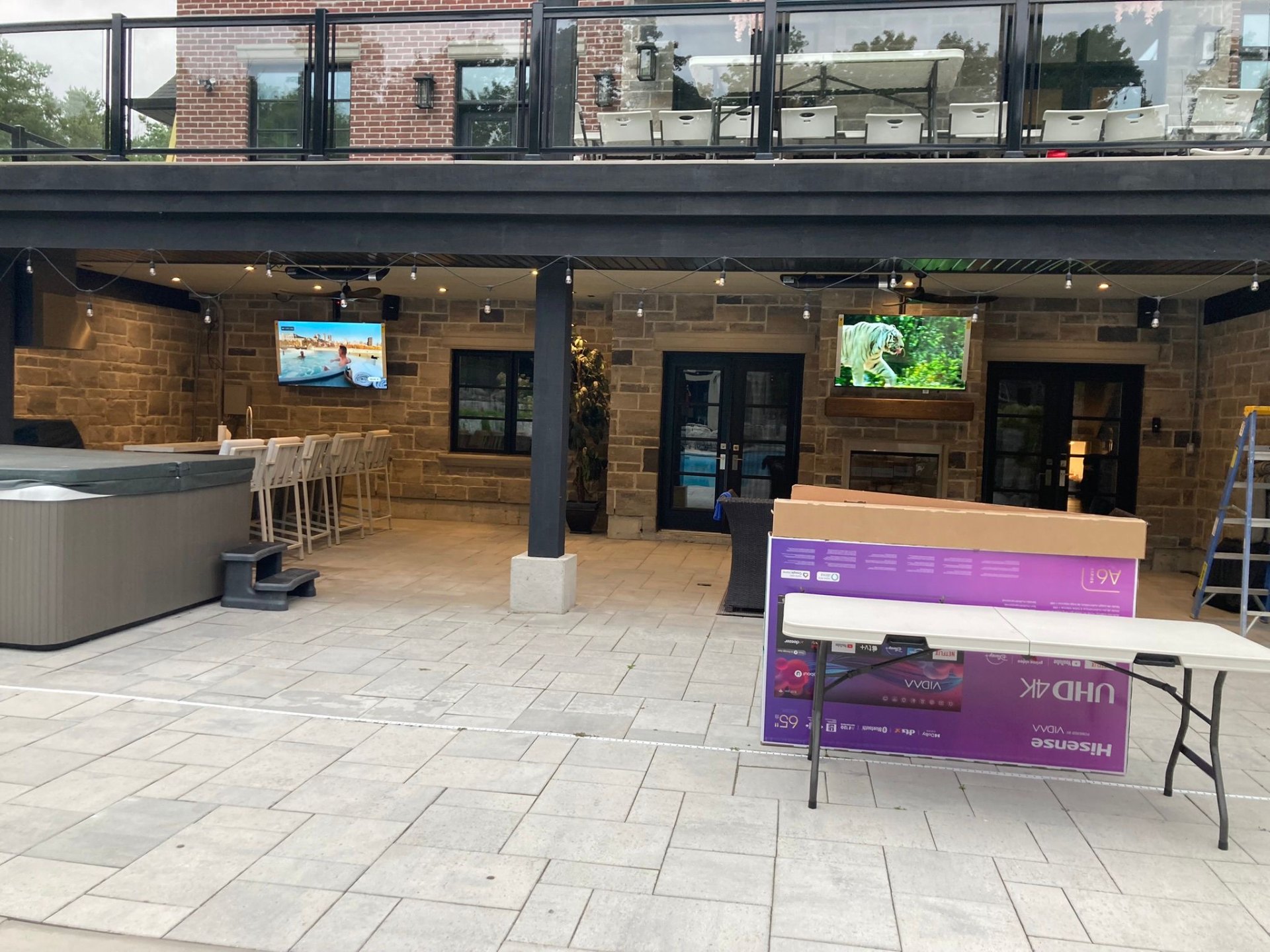 Outdoor TV & soundbar — covered patio