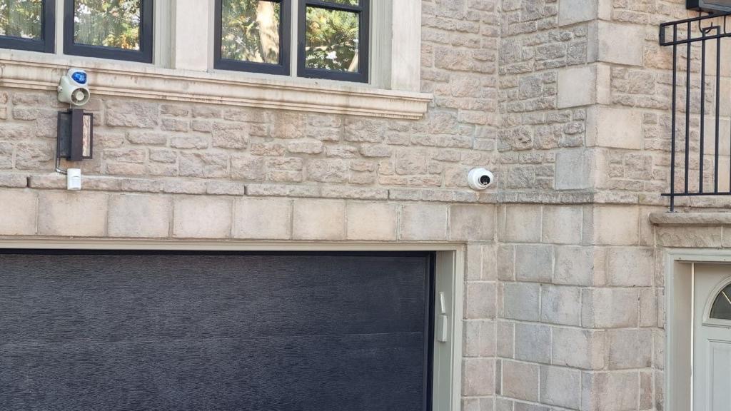 Driveway coverage on stone facade